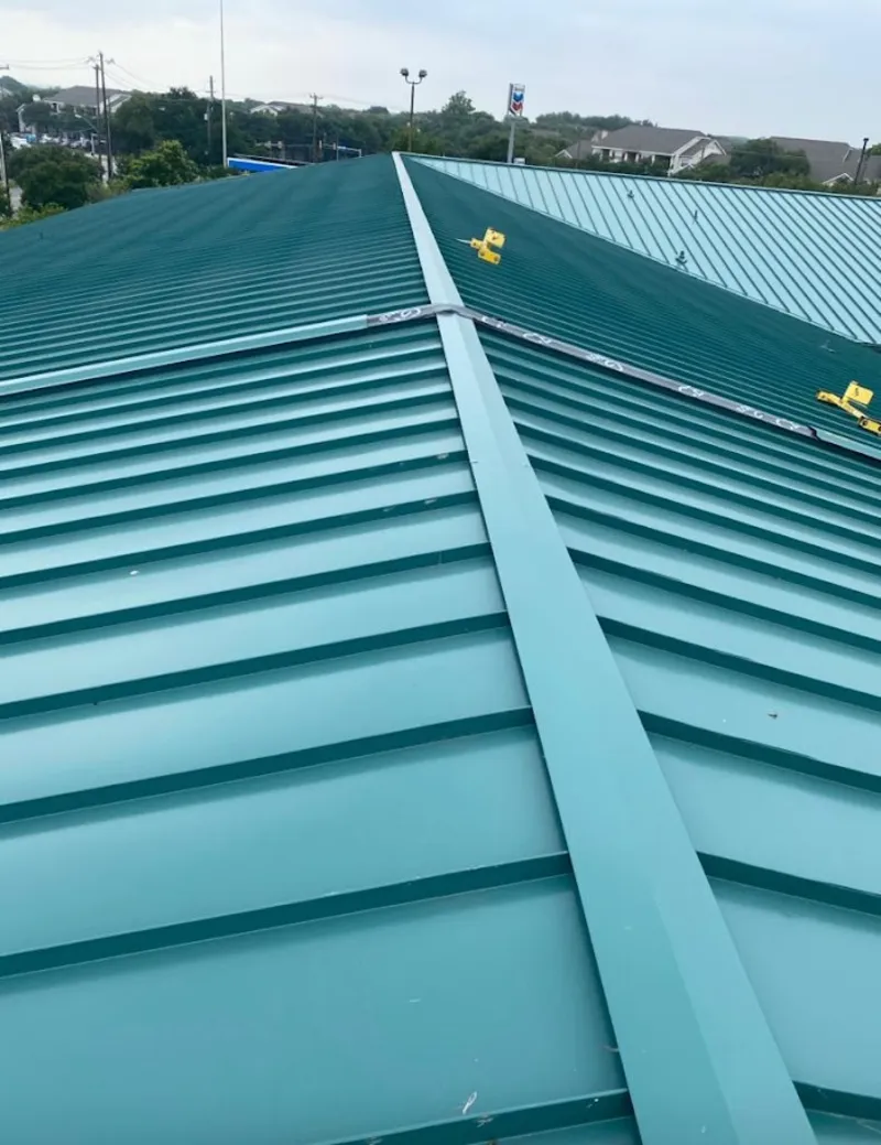 Green commercial metal roof ridge and valley for Metal Roof Repair in Sturgeon Bay